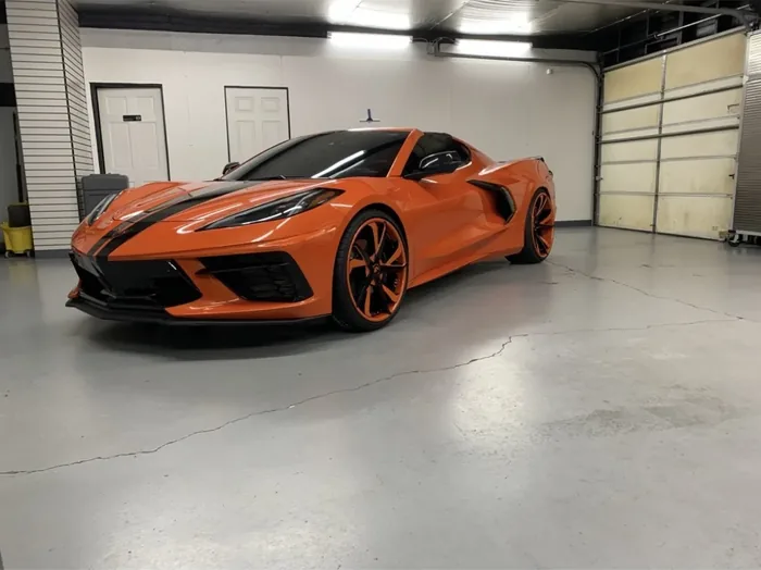 Orange Chevrolet Corvette C8 with tinted glass